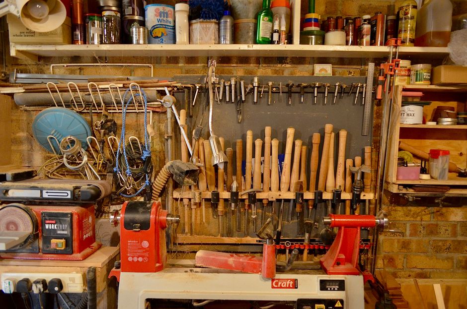 A well-organized woodworking workshop with various tools and equipment neatly arranged.